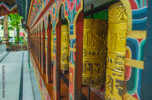 Bhutanese prayer wheels or Mani wheels, made of copper with the holy mantra printed on the wheels, the symbol of Bhutanese