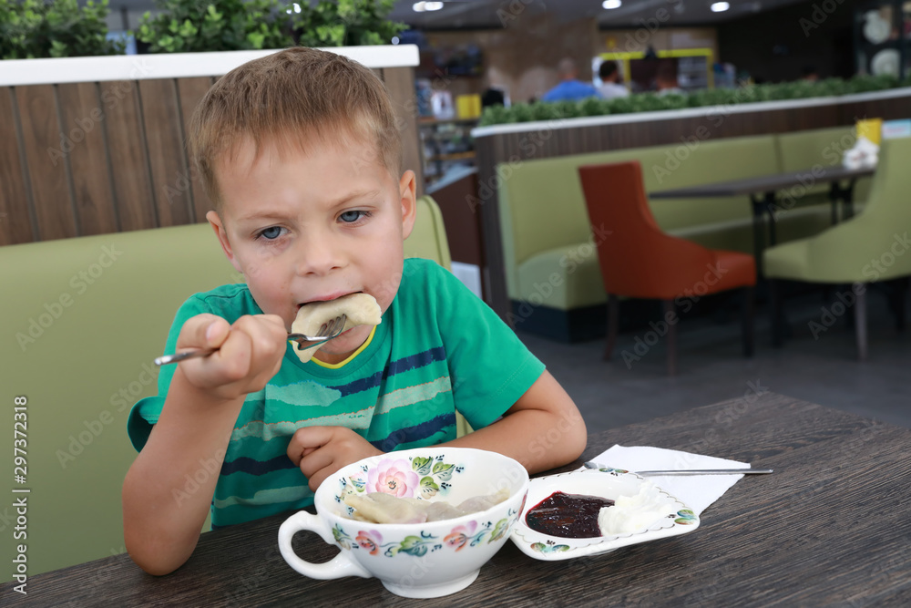 Kid eating Dumplings Kid eating Dumplings