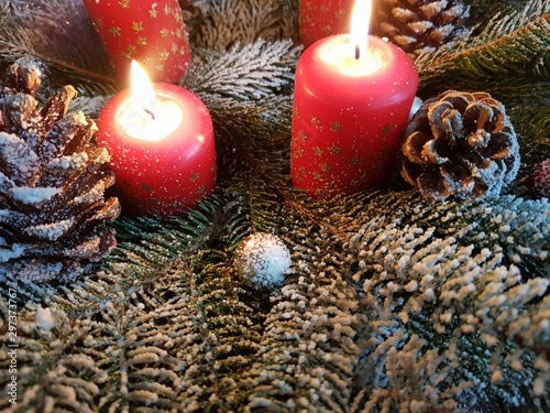 christmas decoration with candle and cones