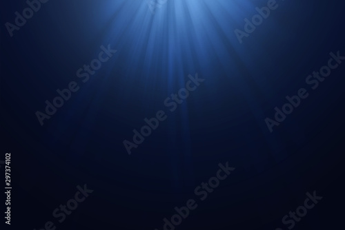 light rays through in deep blue water background