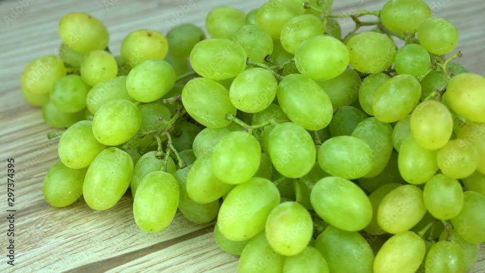 green grape rotating closeup slow motion 4k, on wood green grape rotating closeup slow motion 4k, on wood