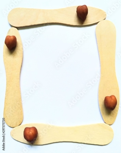 Frame made with chickpea on icecream sticks.Unique concept for world heart day.