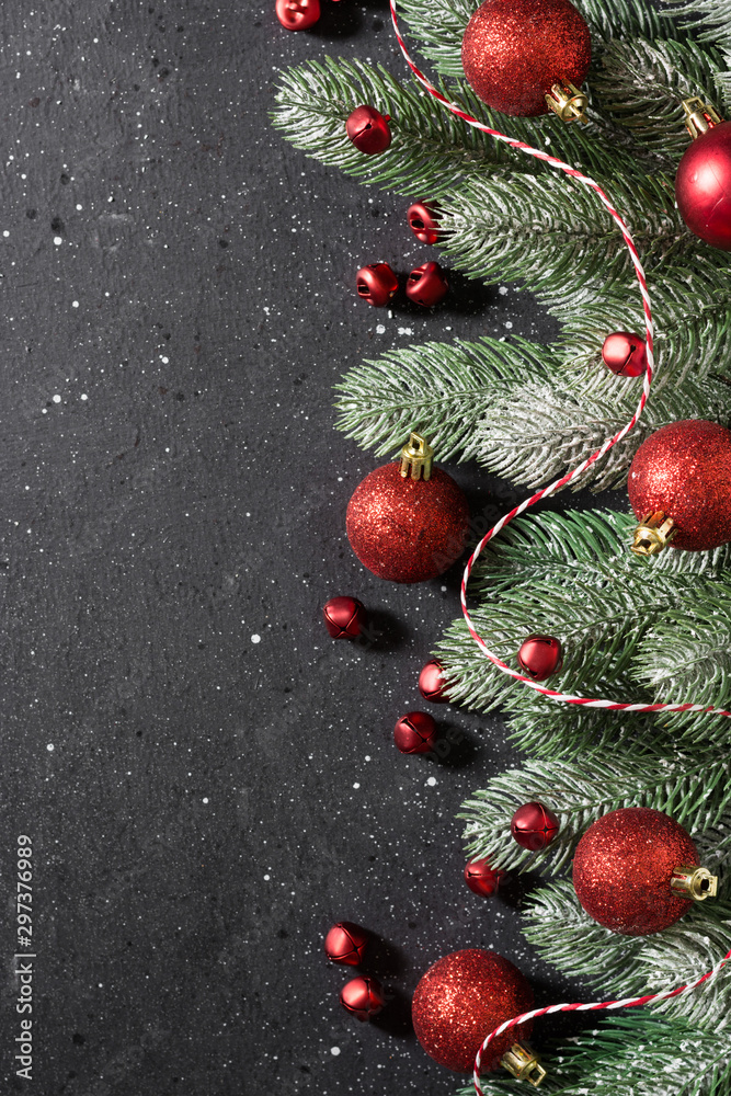 Christmas or New year holiday background with fir branches and red decorations. Top view with copy space Christmas or New year holiday background with fir branches and red decorations. Top view with copy space
