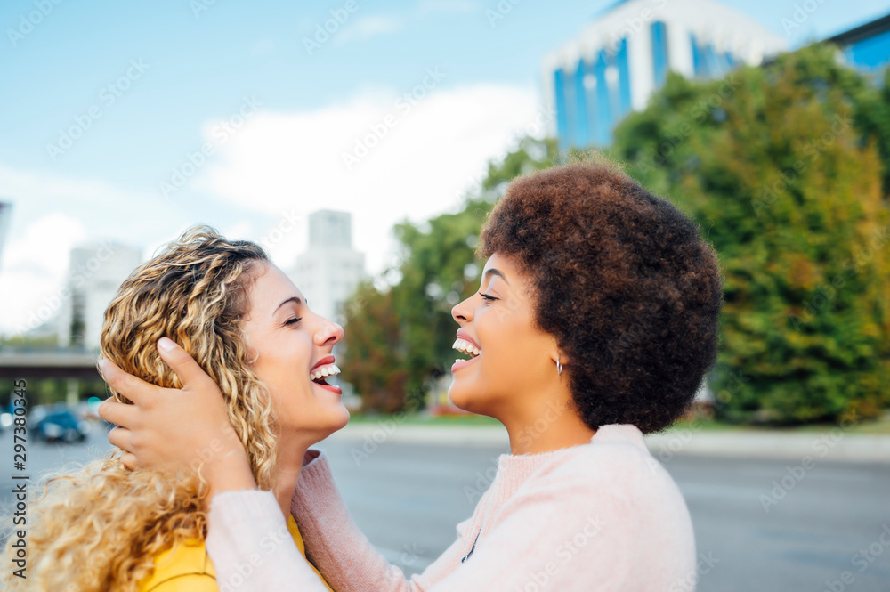 Loving lesbian couple at the street. LGTB concept Loving lesbian couple at the street. LGTB concept