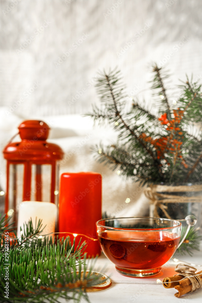 Cozy autumn winter home, Christmas eve. Cup tea, autumn garland on a wooden table near the bed with warm plaids. Autumn lifestyle lagom hygge.holiday and a weekend in the fall in winter on holidays. Cozy autumn winter home, Christmas eve. Cup tea, autumn garland on a wooden table near the bed with warm plaids. Autumn lifestyle lagom hygge.holiday and a weekend in the fall in winter on holidays.
