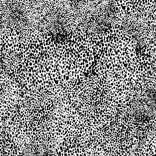 Small uneven spots and particles of debris. Abstract vector texture.  Distressed uneven background. Grunge texture overlay with fine grains isolated on white background. Vector illustration. EPS10.
