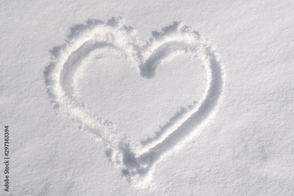 Symbol of heart, painted on the fresh white snow