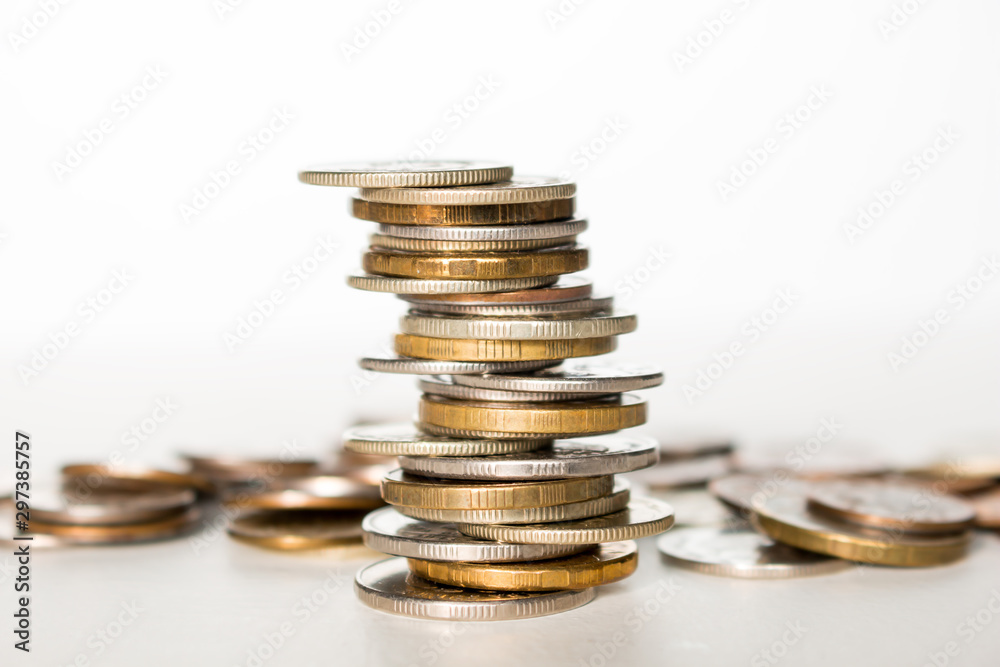 stack of coins on a white background concept saving money business growth stack of coins on a white background concept saving money business growth