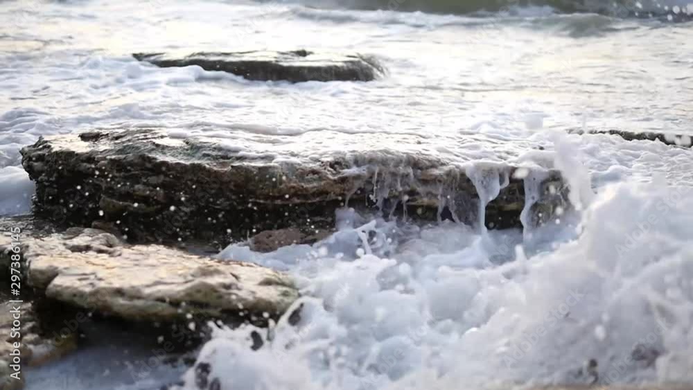 Storm at sea. Big waves break on the rocky shore, white foam on the water. Black Sea Storm at sea. Big waves break on the rocky shore, white foam on the water. Black Sea