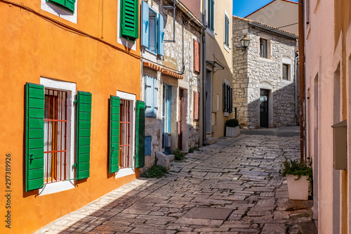 - Narrow stone street with colourful building facades in romantic Town of Rovinj  Istra  Croatia