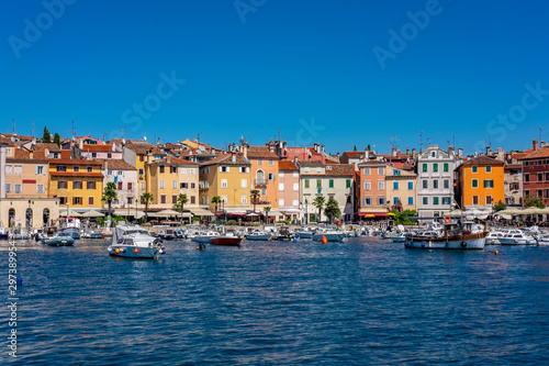 Panoramic view of harbour and houses with colourful facades in Town of Rovinj on sunny summer day, Istra, Croatia 