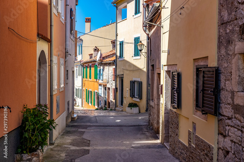 Narrow street with colourful building facades in romantic Town of Rovinj  Istra  Croatia