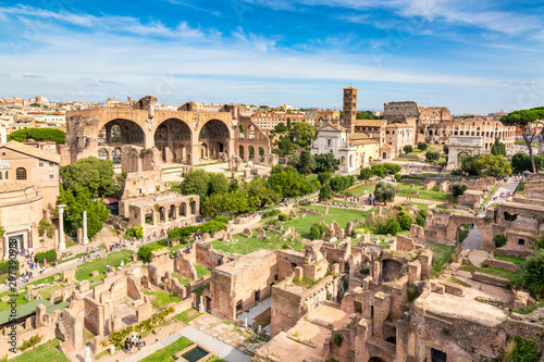 Fototapeta Aerial panoramic cityscape view of the Roman Forum and Roman Colosseum in Rome, Italy