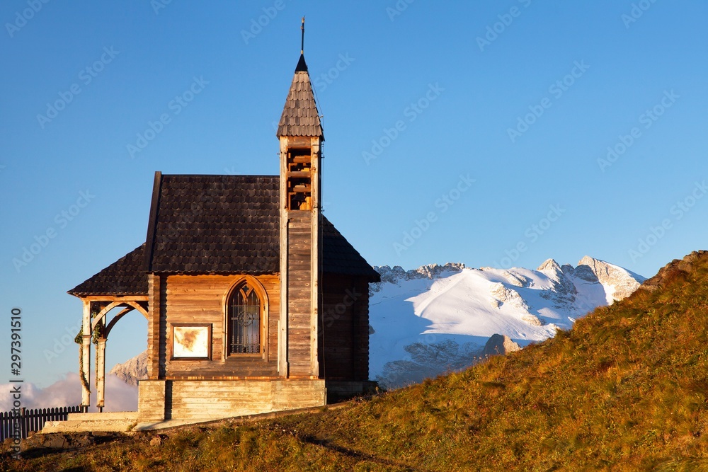 church or chapel on the mountain and Mount Marmolada