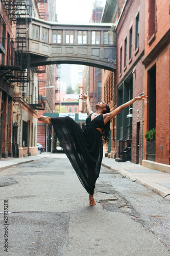 Dancer arching body on pointe
