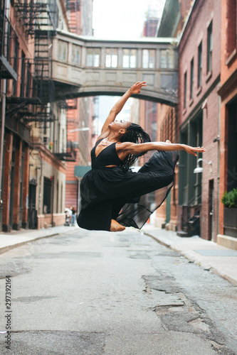 Dancer leaping with both feet off the ground