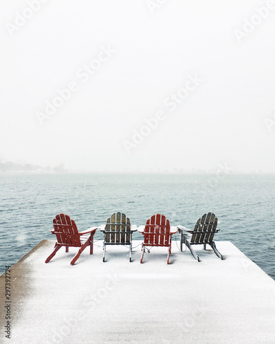 Wooden chairs placed on dock