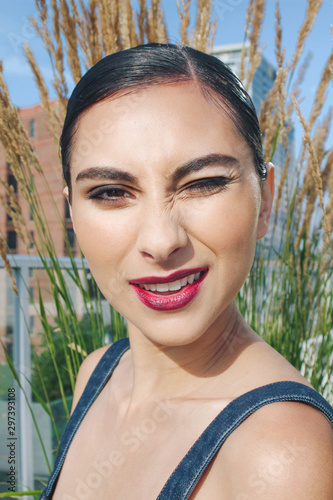 Close up view of woman winking