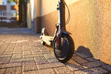 Electric scooter on a background of a wall