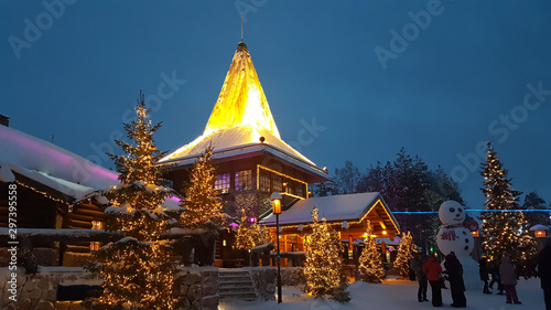 Evening Winter in Santa Claus Village. Rovaniemi behind the Arctic circle, Lapland, Finland photo