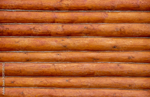 rough wooden timber background , brown and orange log wall texture , beam walls close up for building design