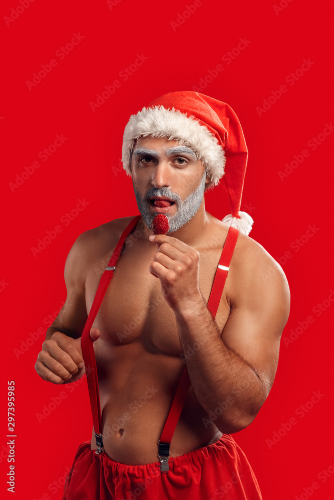 Funny Muscular Santa in Santa Hat and White Underwear. Christmas