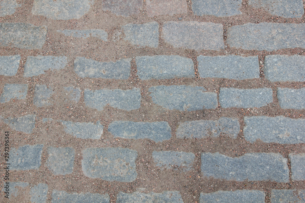 Obraz premium The texture of the floor is made of stones held together by earth and crumbs of fine gravel