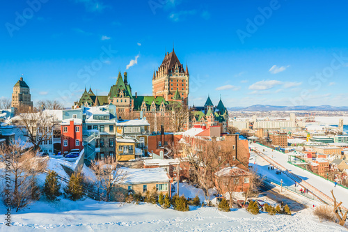 City Skyline of Old Quebec City with Chateau Frontenac, Dufferin terrace and St. Lawrence River in Winter photo
