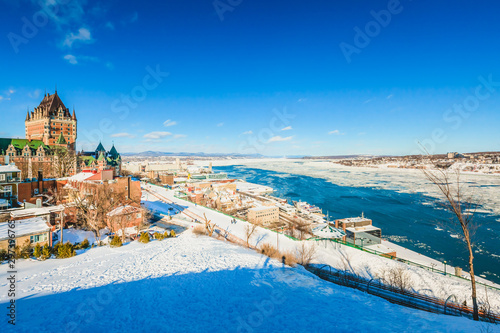 Panoramic City Skyline of Old Quebec City with Chateau Frontenac, Dufferin terrace and St. Lawrence River in Winter photo