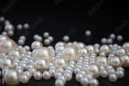 Bunch of multi size pearls on a background.Glamorous pearls milky-way.luxury lifestyle.Holiday decoration.Nice and shiny romantic morning.Love and success.