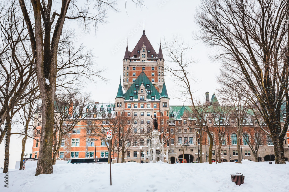 Winter Landscape of Chateau Frontenac and Dufferin Terrace During Winter Season with Trees and Snow in the Front in Old Quebec City, Canada