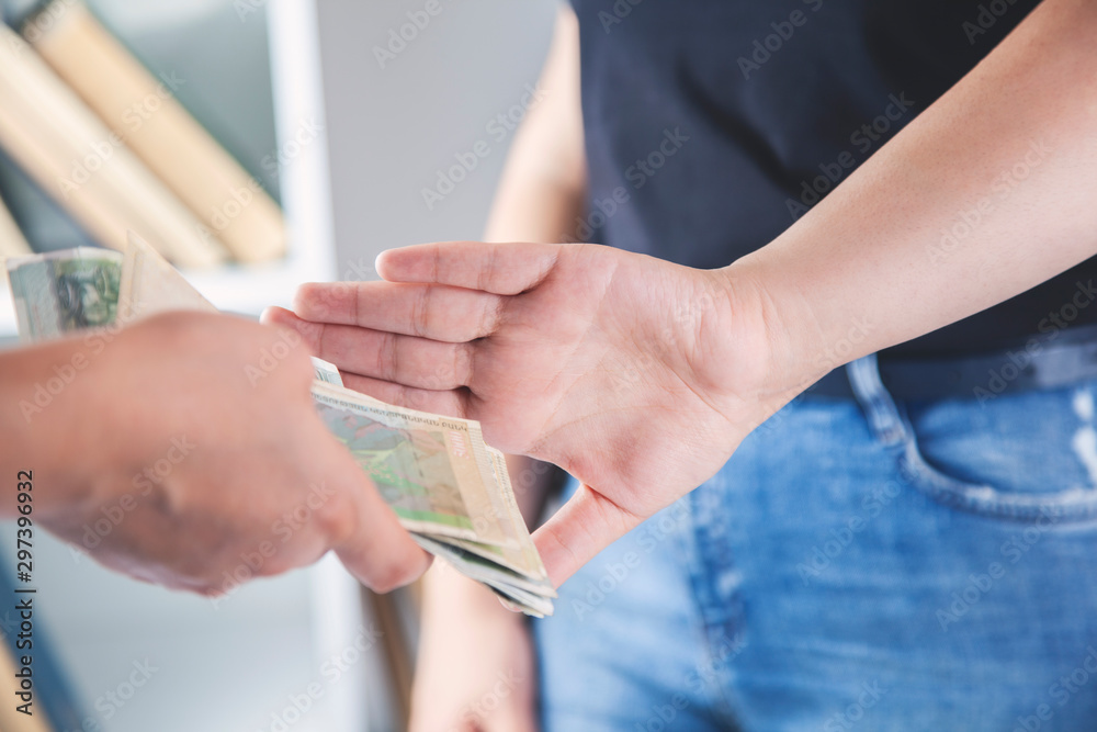 woman hand stop sign in money