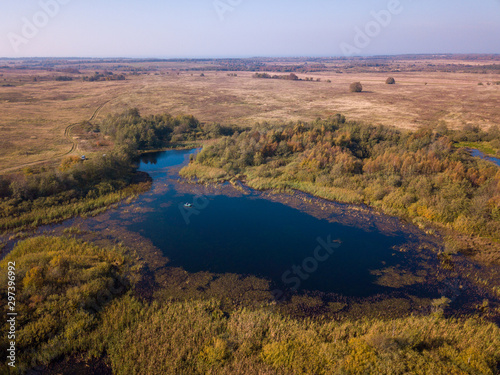 Aerial landscape of a lake in the forest at summer