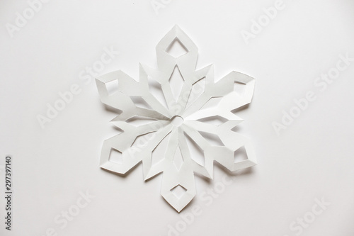 Large white snowflake on white backgound