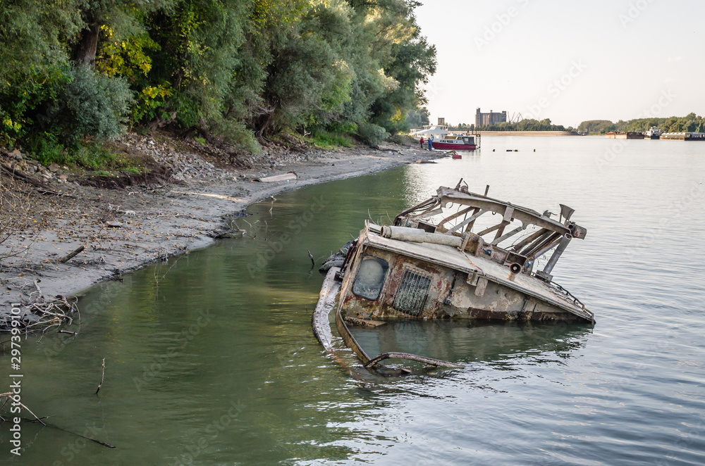 Novi Sad, Serbia - September 29. 2019: The wreck of the tanker at the Danube River in Novi Sad