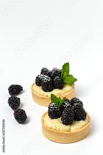 homemade Tart  tartlet  with blackberry and delicate cream of vanilla and mint