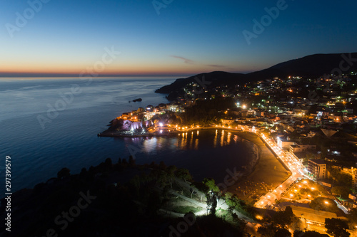 Fototapeta Naklejka Na Ścianę i Meble -  Aerial view of the old city of Ulcinj at night - the southernmost city of the Montenegro.
