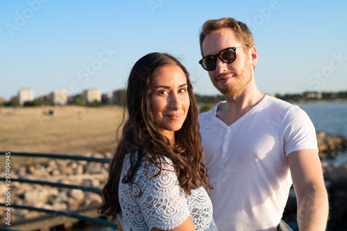 couple on pier at sunset 