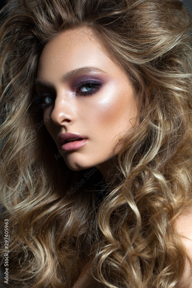 Sexy young model with fashion make up, perfect skin, healthy blowing hair and nude lips. Sexy young model with fashion make up, perfect skin, healthy blowing hair and nude lips.