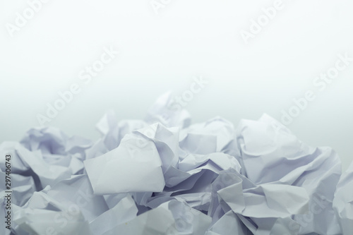 Crumpled white paper is mauled on white blackground with copy space. ideas concept