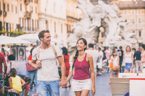 Photography Rome travel young couple tourists walking in city streets on Navona Square sightseeing in Italy