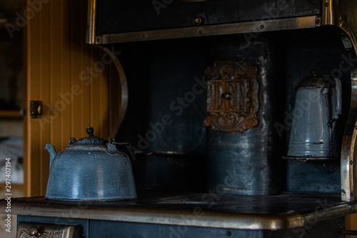 Wooden, copper, metal old vintage pots, jars, pan, wheel in retro style. Vintage kitchenware