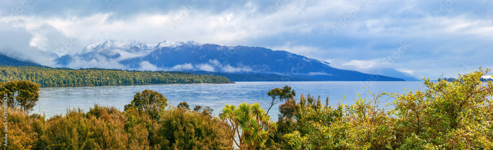 Picturesque Te Anau lake and blue mountains panorama, New Zealand