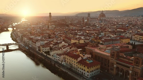 Aerial Drone View: Historically and Culturally Rich Italian Town on the Sunny Day. Beautiful Old City With Medieval Churches and Cathedrals. River Runs through the City photo