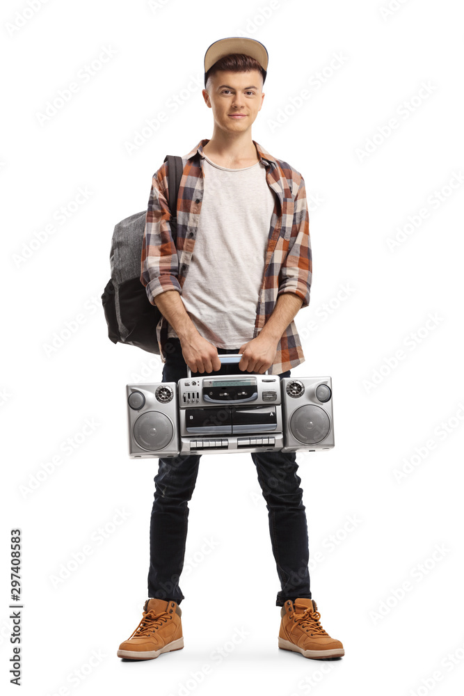 Male teenager holding a boombox radio