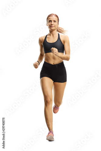 Female athlete in running outfit jogging towards the camera © Ljupco Smokovski