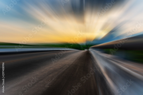 Blurred asphalt road blurred blue sky