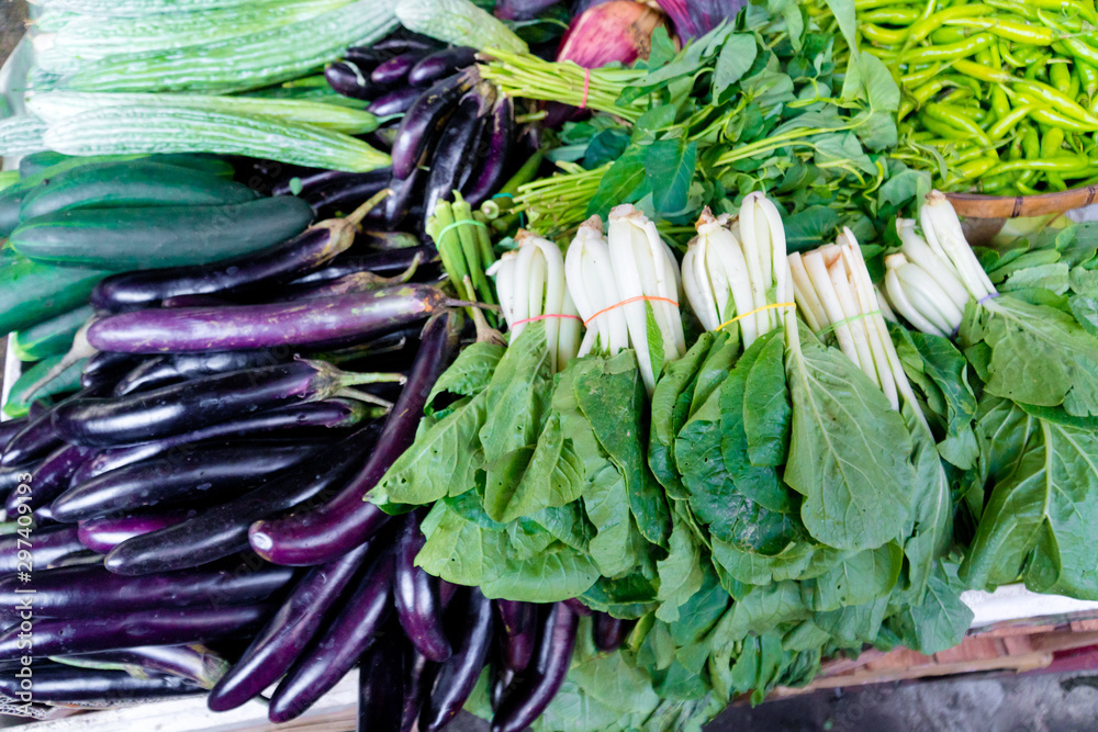 Various vegetables on the counter. organic fresh fruits and vegetables on grocery counter. Selling vegetables in Asia.