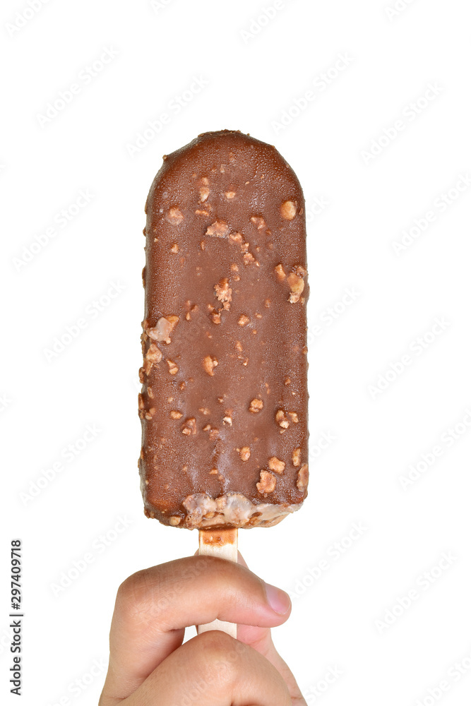 female hand holding chocolate popsicle female hand holding chocolate popsicle