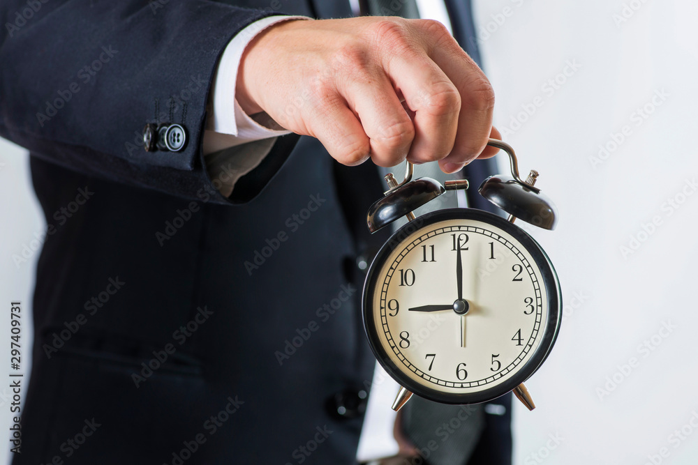 Fotografie Businessman hold alarm clock